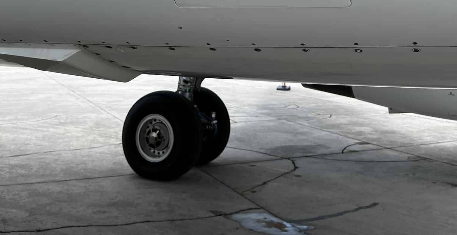 Close-up photo of A320 nose wheel showing tire size markings